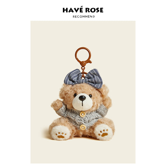 Teddy bear keychain with a bow on a beige background, featuring the brand 'Have Rose'.