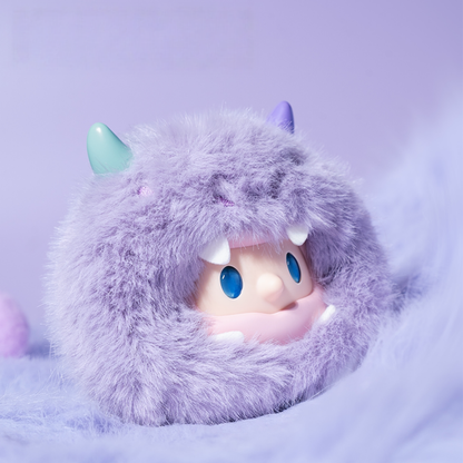 Adorable pastel-purple fluffy dragon plush with tiny horns and bright blue eyes, soft and pocket-sized – a charming bag charm that adds a touch of whimsy wherever you go.