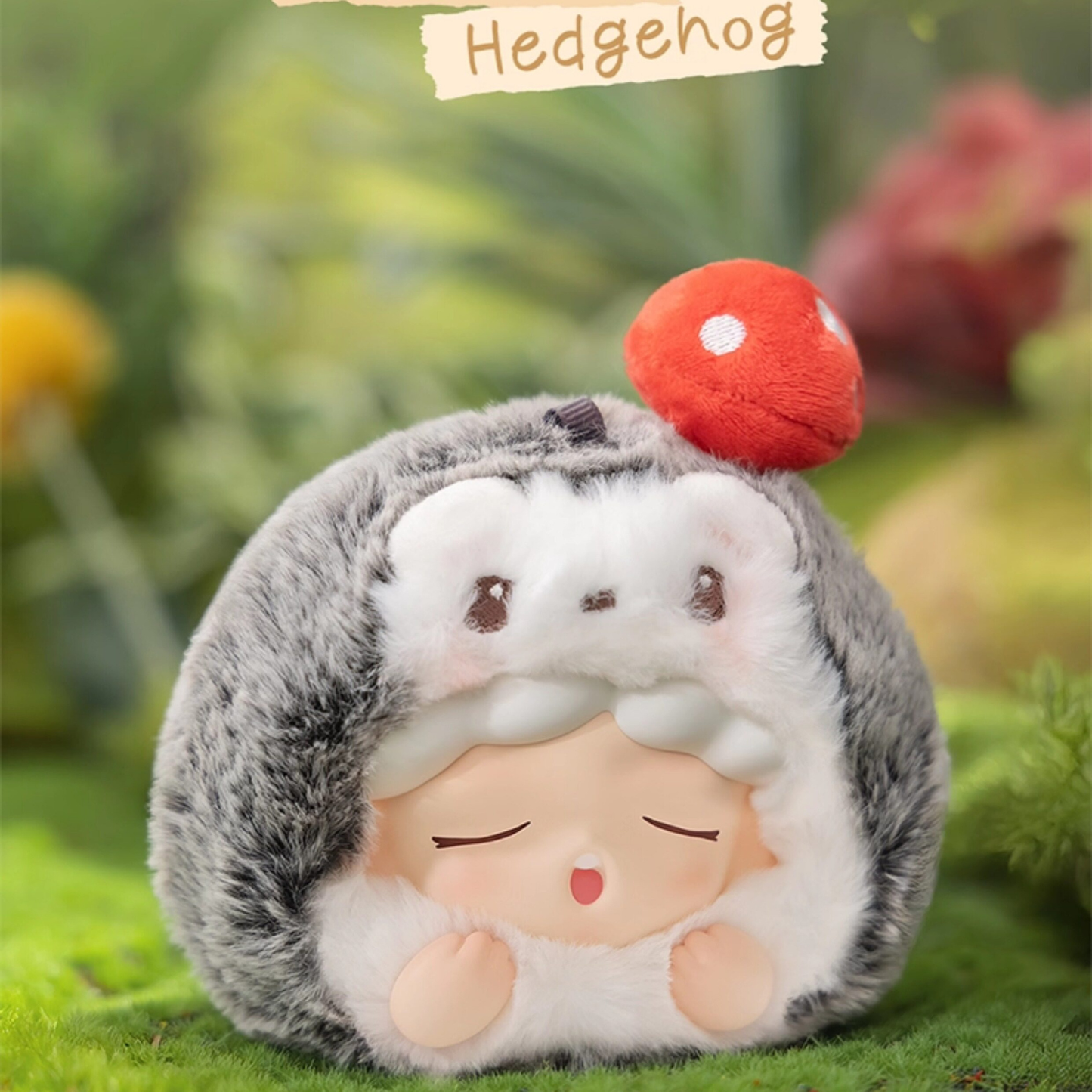 YUMO Plush toy  in a gray hedgehog costume with a red small mushroom. It's really cute and lovely.  It can be used as a bag charm. It is a great companion in people's lives.