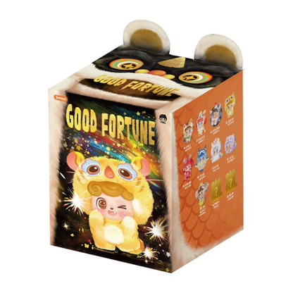 Q kid figure in packaging with 'Good Fortune' text and colorful design