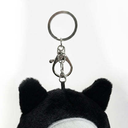 Black and white plush keychain  called Koko the skeleton  with a keyring on a white background
