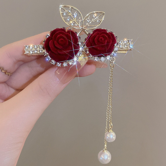Decorative brooch with red roses, gold leaves, and pearl pendants. Beautiful and Classic