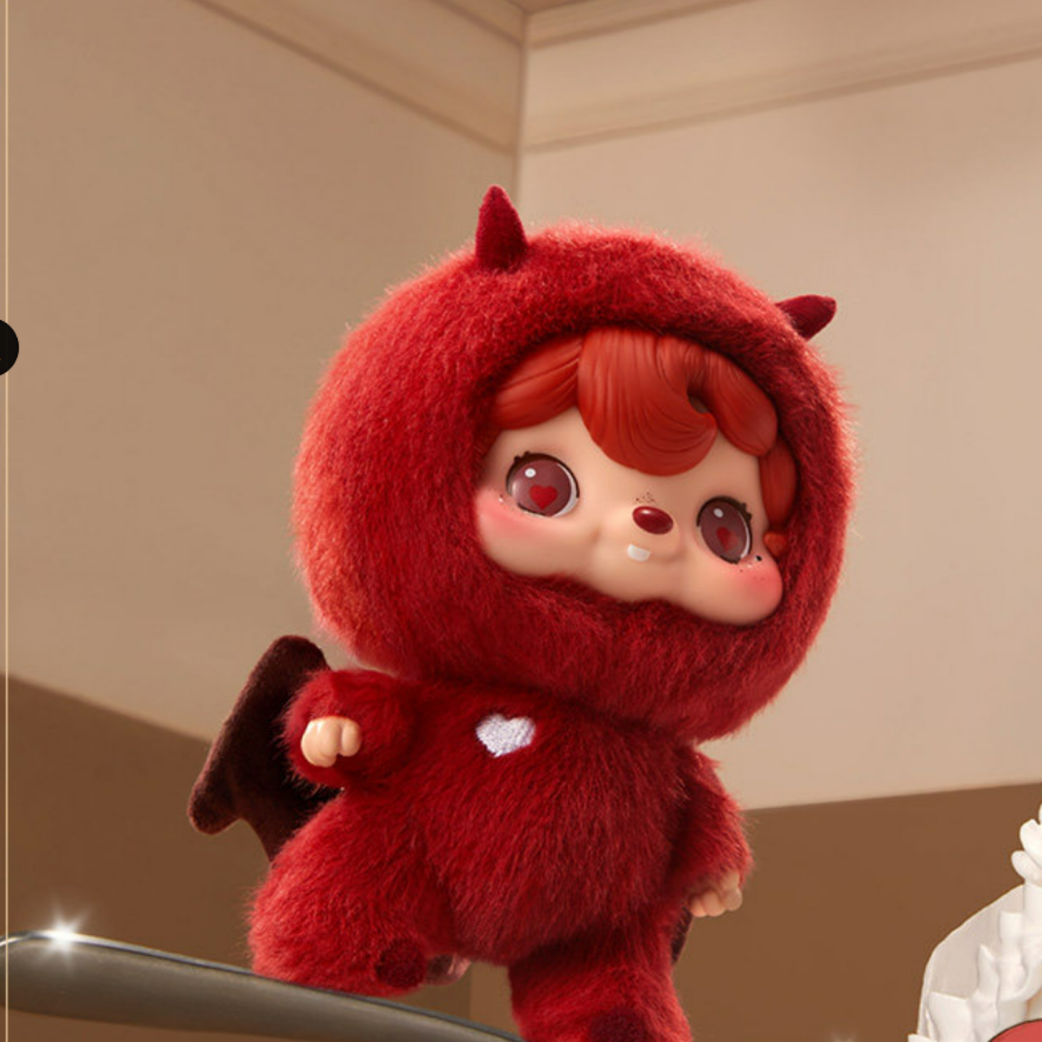Cute and red plush toy named Little Devil with a hood and small wings.