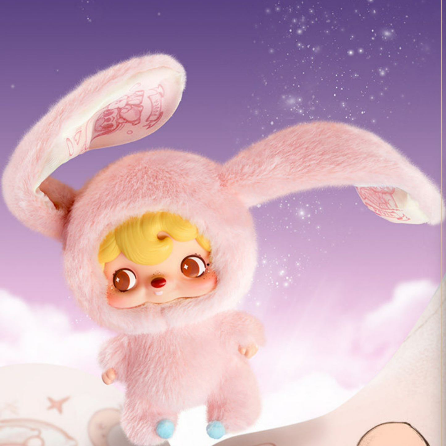 Pink and cute Padada plush toy with bunny ears and golden hair.