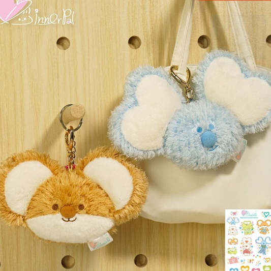 Two Plush Cute Toy Bag Charms. One is brown, another is blue. Both of them have big ears. They can also be used as a keychain.