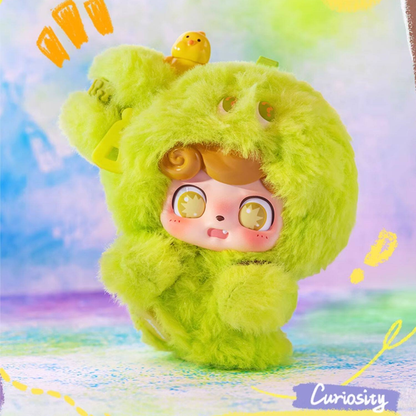 Vibrant green “Curiosity” plush Q kid with wide golden eyes and playful expression – a quirky pocket-sized pal for everyday adventures. It can be used as a bag charm.