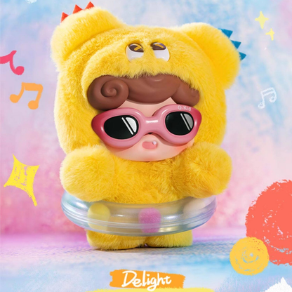 Sunny yellow “Delight” plush Q kid with pink sunglasses and cheerful flair – a fun, feel-good accessory for your handbag or backpack. 