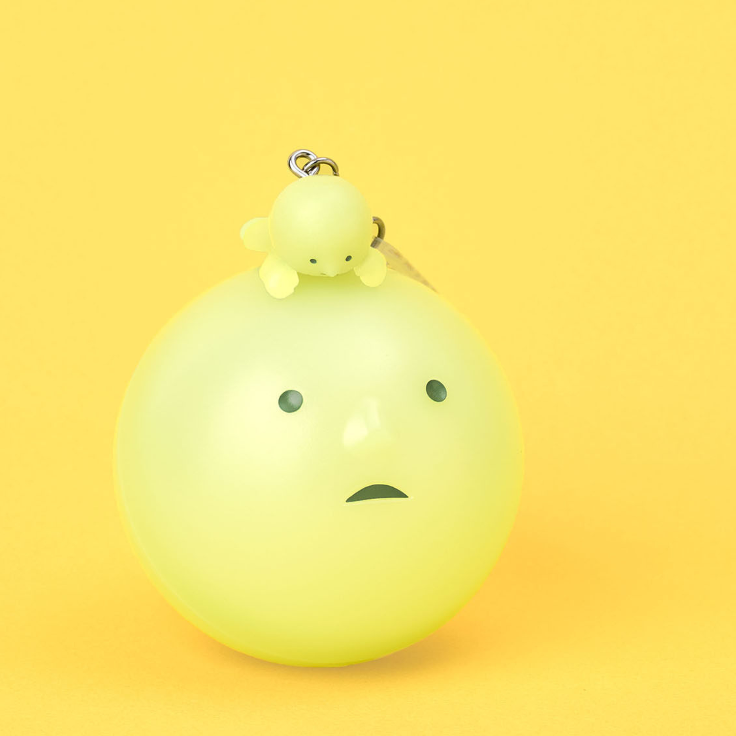 Ball SMISKI with cute face and a little SMISKI lying on top of it