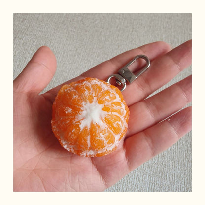 Ultra-Realistic Orange Keychain On hand