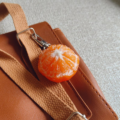Ultra-Realistic Orange Keychain on Bag