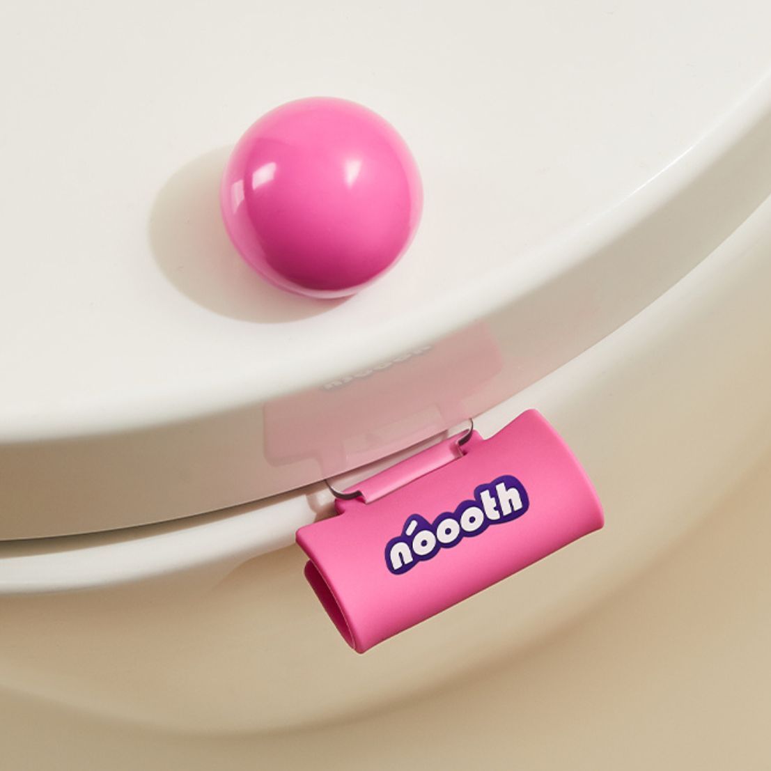 Pink ball and 'nooth' Label Toilet Lifter